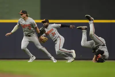 Orioles outfielder Ramón Laureano leaves game after hurting his ankle while chasing a fly ball
