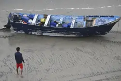 5 people charged after migrant boat capsized, killing 3, including 14-year-old boy from India